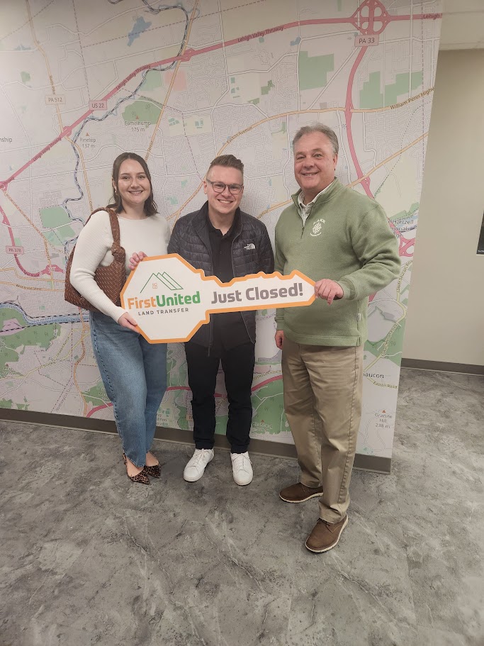 Tim Tepes with happy clients at their new home