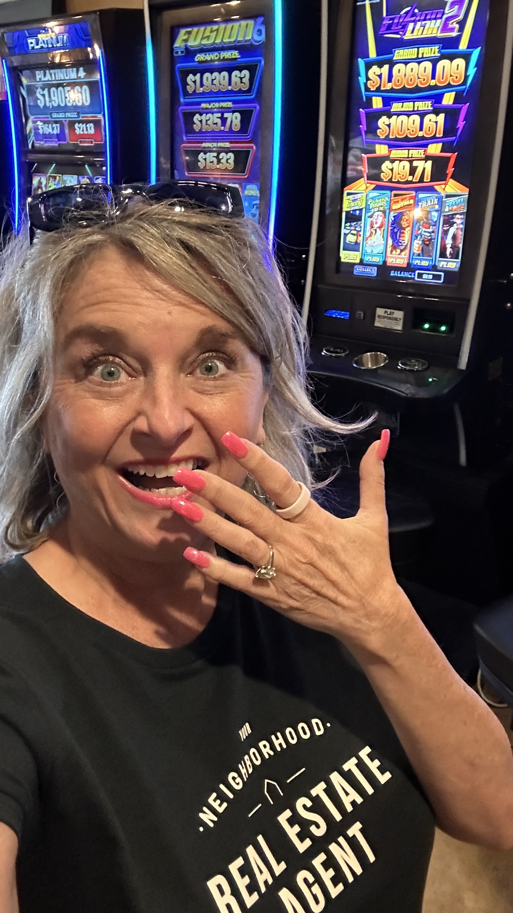 Lisa at the slot machines taking a selfie at Old Fountain Tavern in Dacula Georgia