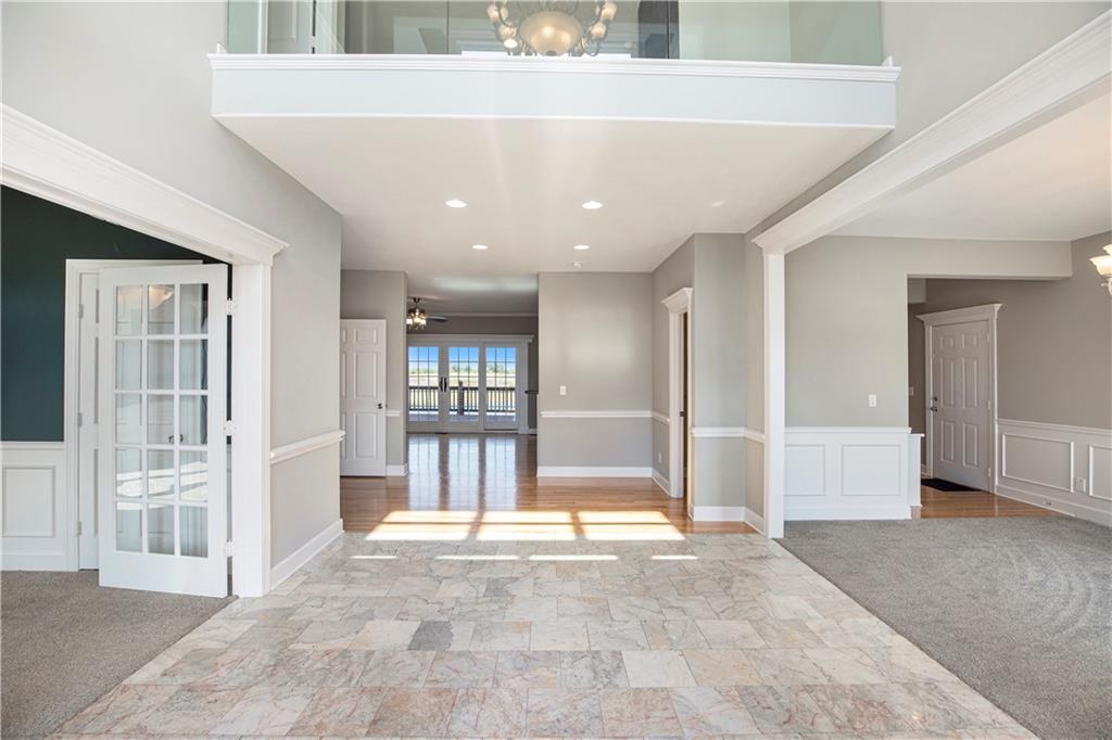Open foyer with vaulted ceilings