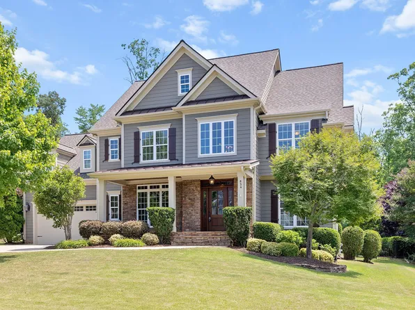 Front exterior facade of a traditional craftsman-style home in Highcroft, Cary NC