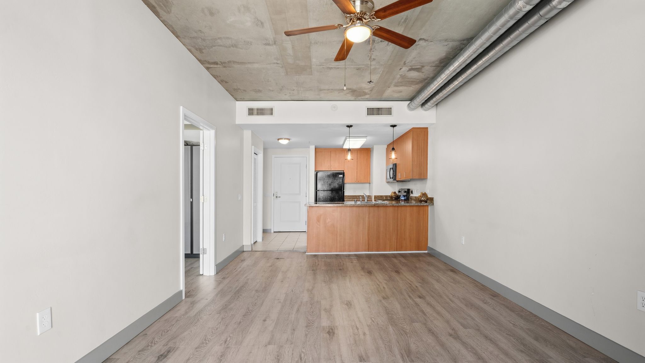 Modern kitchen with quartz countertops and stainless steel appliances