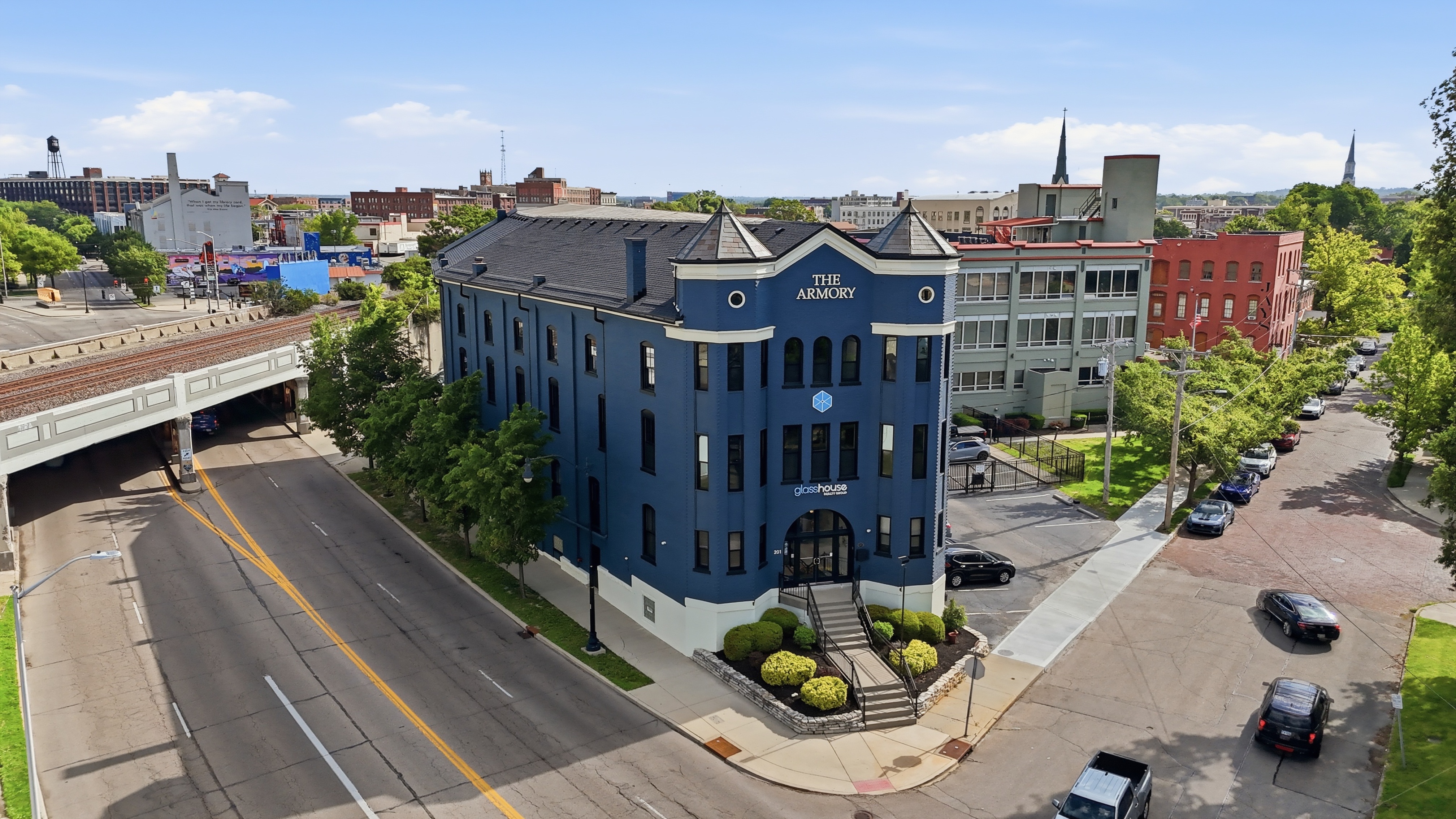 Historic Dayton Armory building — a grand stone chateau-style landmark on a city street corner, showcasing local real estate character and architecture
