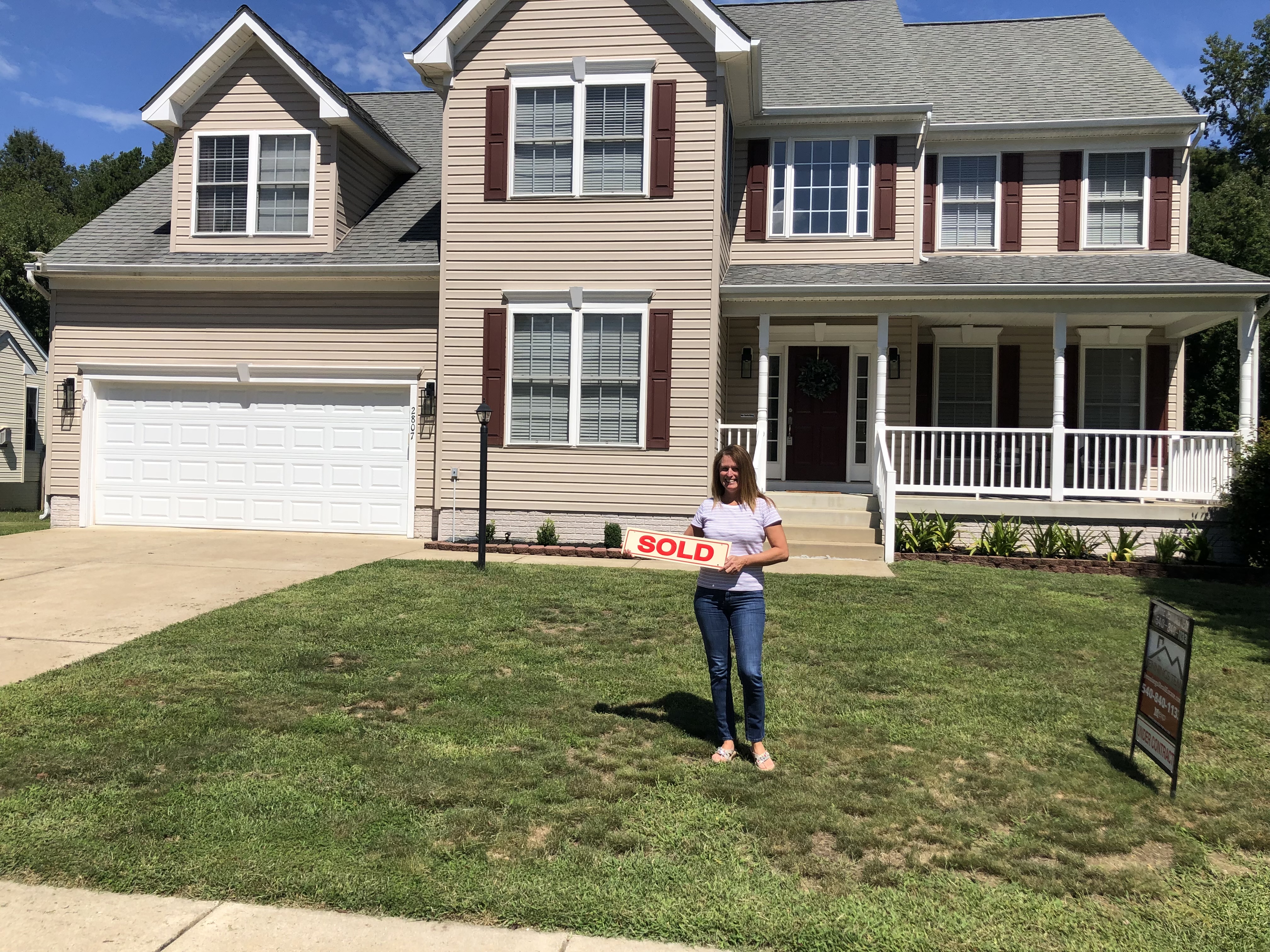 Client celebration photo — successful real estate transaction