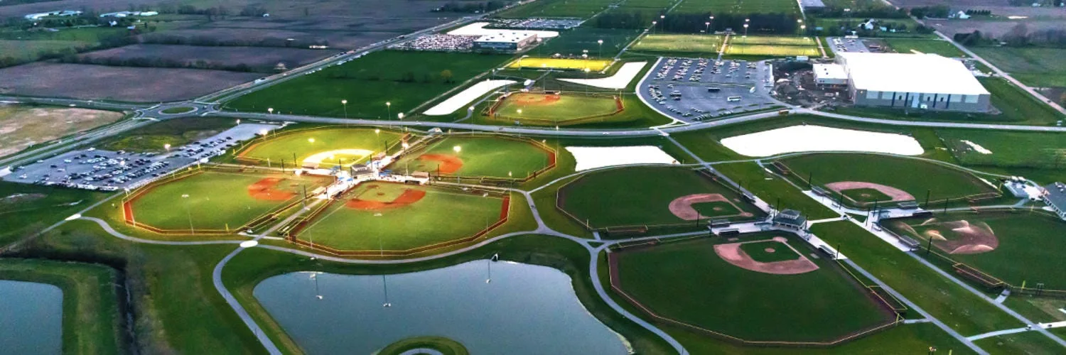 Aerial view of sports complex in Westfield with red and green fields