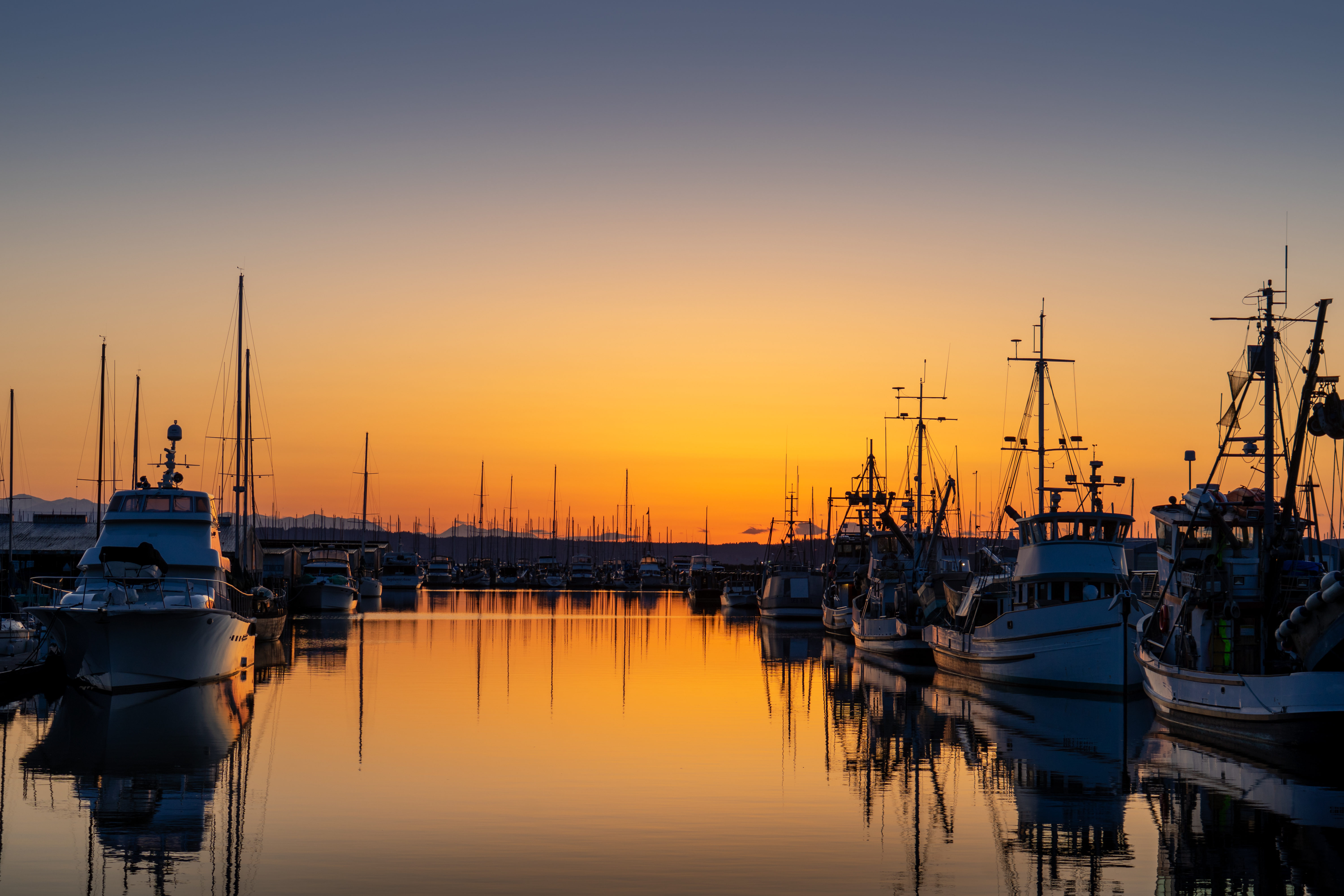 Sunset over the Everett Marina with moored boats in Everett, Washington