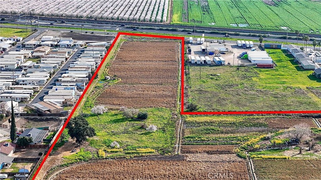 Landscape view of the rural property at 2577 Lobo Ave with open sky
