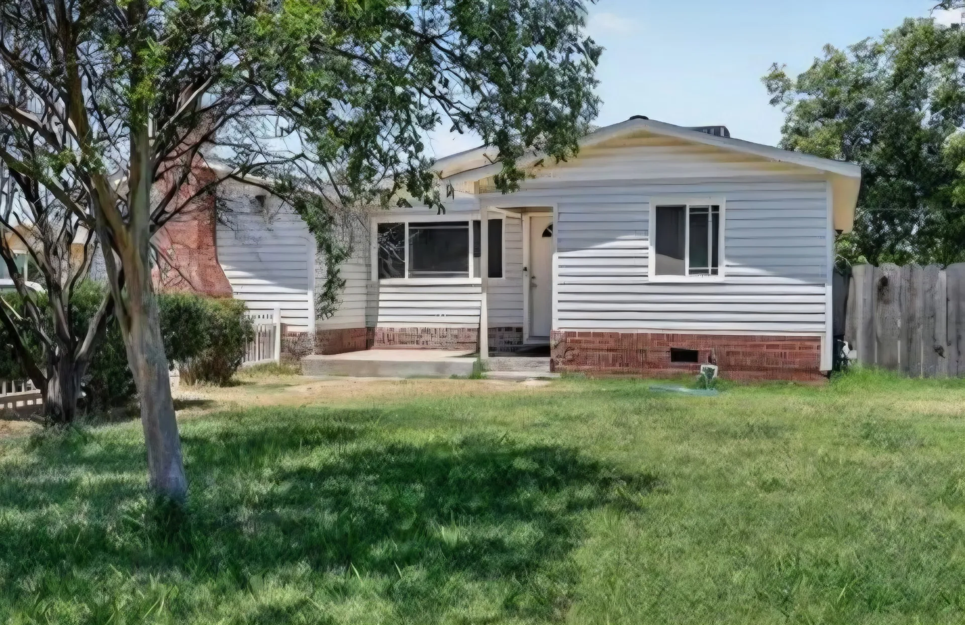 Front exterior of the home at 1565 E Santa Fe Dr in Merced CA