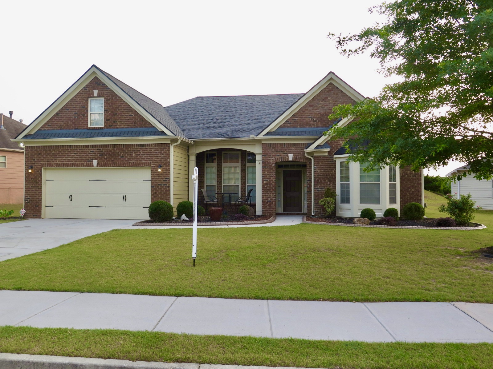 Brick home in southwest Atlanta with a manicured lawn