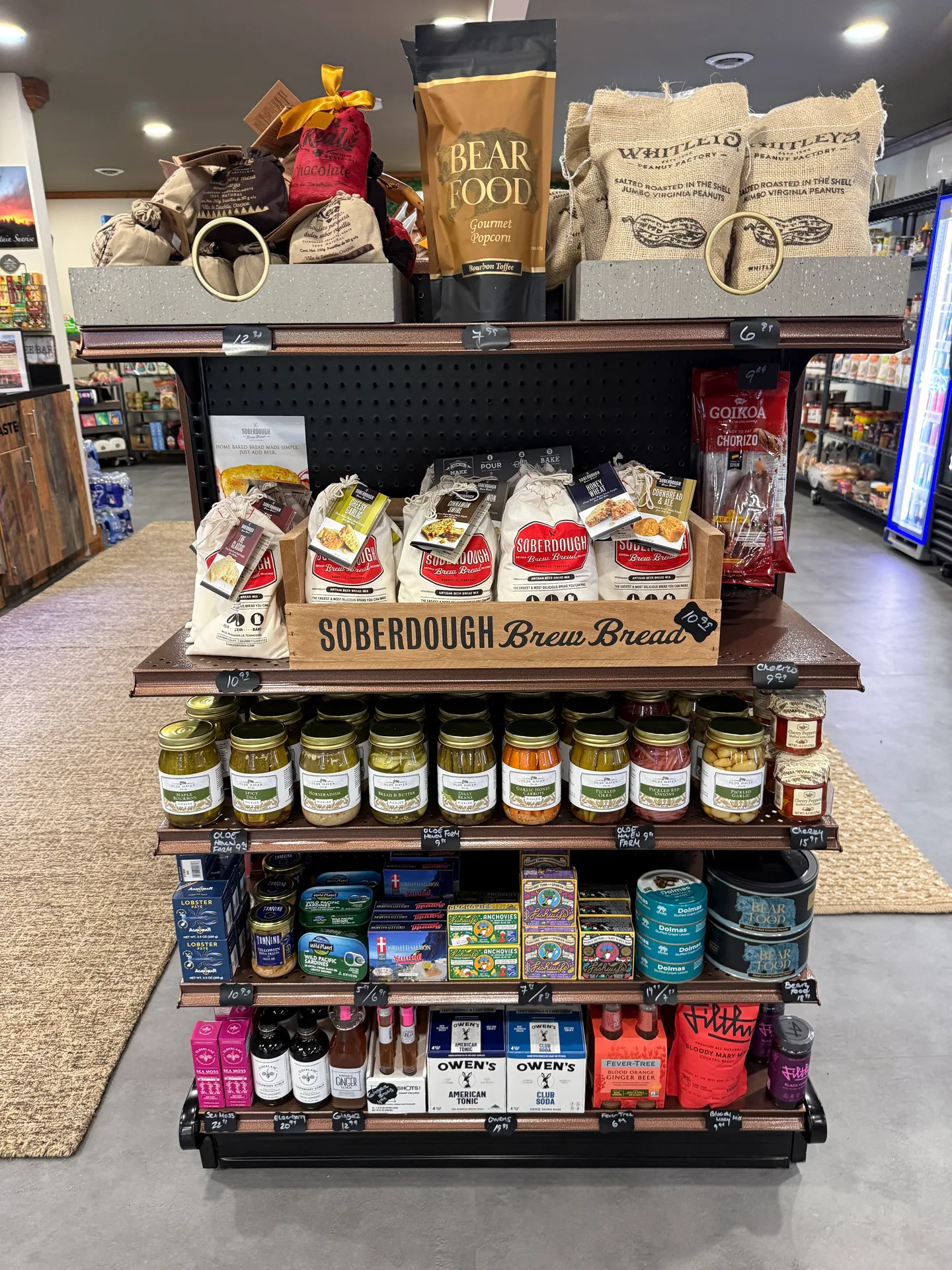 The gourmet shelf at Beechside Goodies with popcorn, bread mixes, and jarred goods