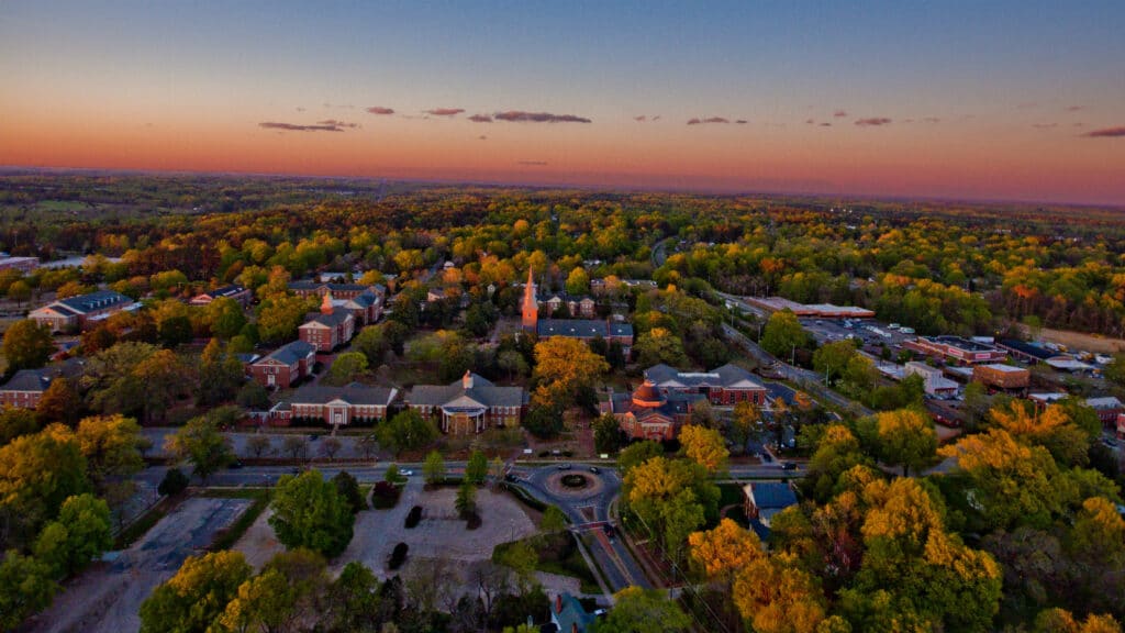 Twilight aerial view of Wake Forest NC historic campus and downtown