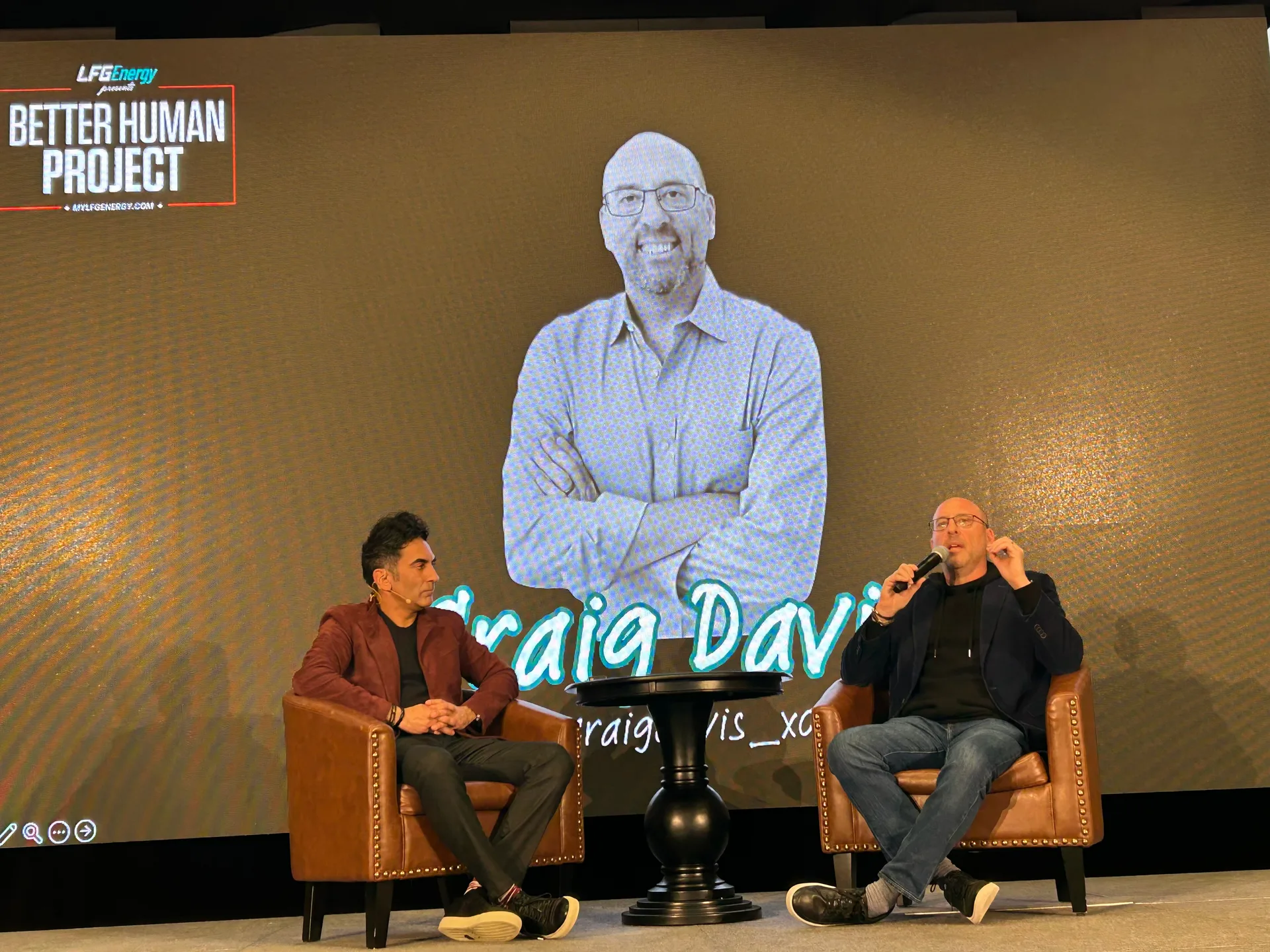 Craig Davis speaking on stage at the Better Human Project