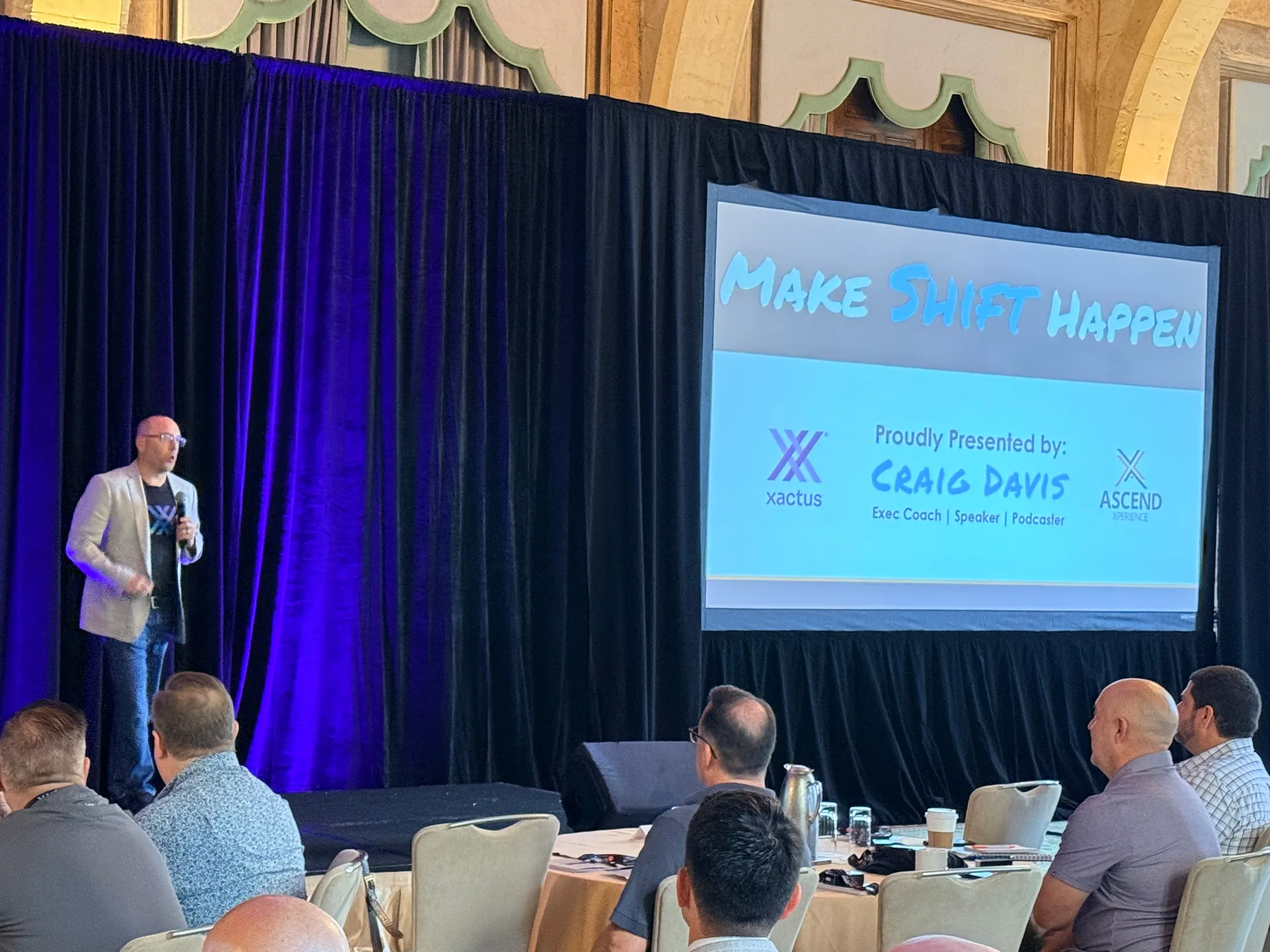 Craig Davis mid-speech at the Xactus Sales Kickoff in Miami