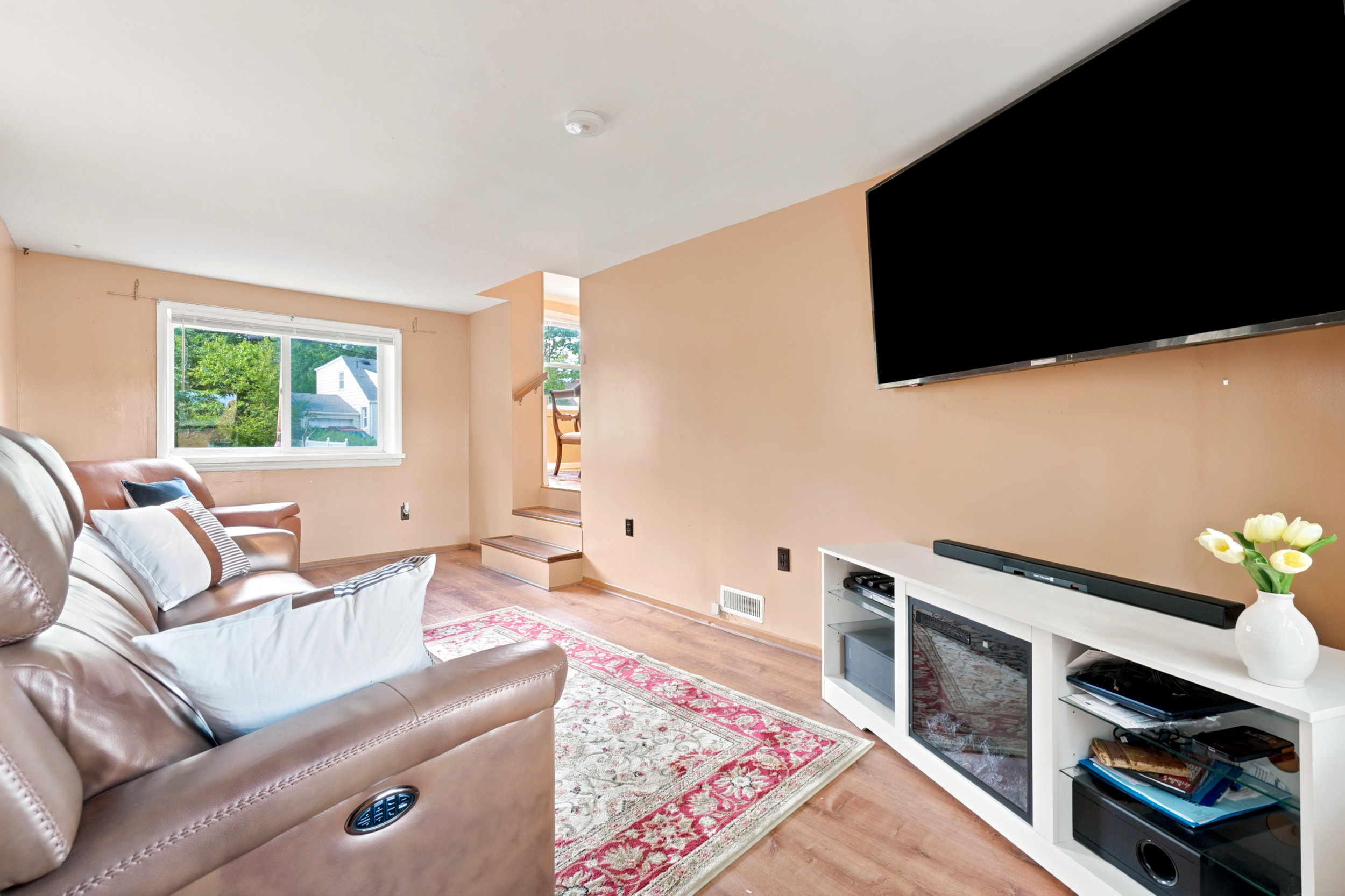 Family room at 50 Heather Ln with the TV wall and new flooring