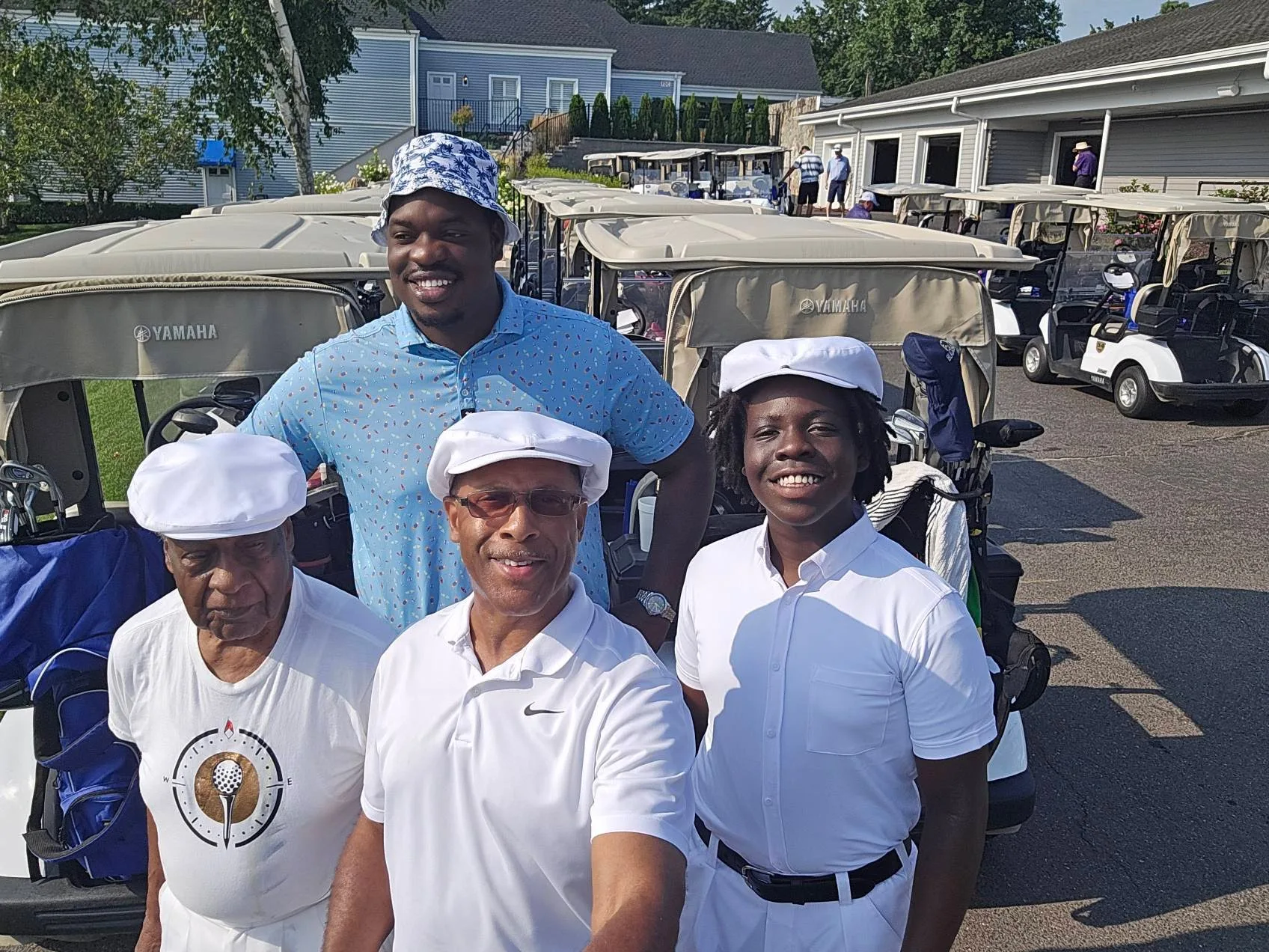 Golfers gather by the carts before teeing off at the Calcagni Golf Classic