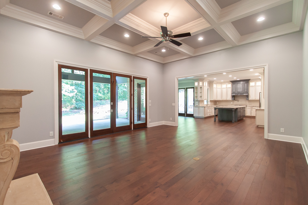 Chef's kitchen with Wolf gas range, granite countertops, and double ovens