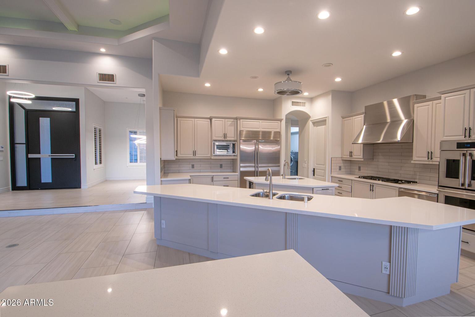 Kitchen second angle with appliances and island view