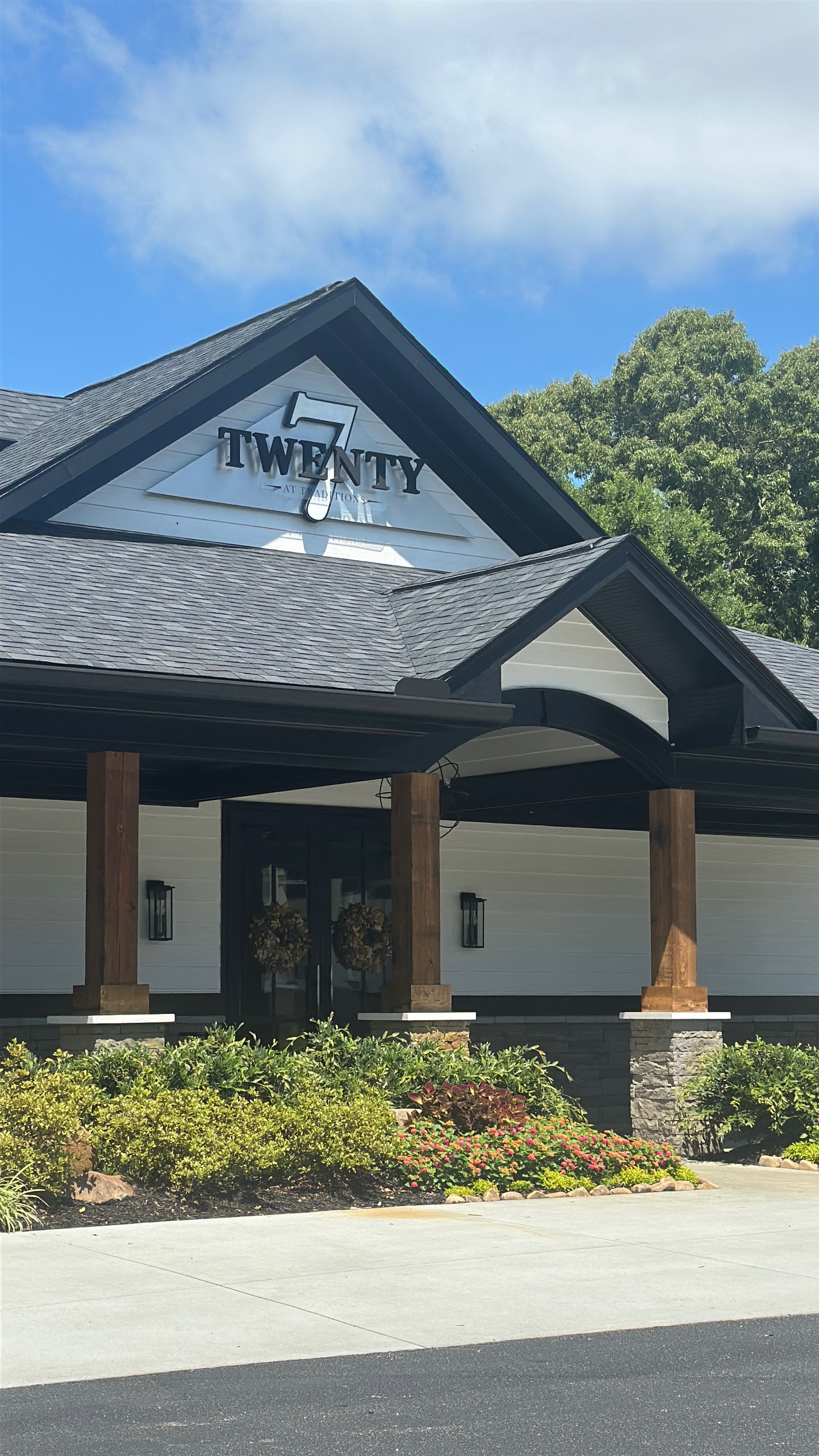 Exterior of the Twenty 7 restaurant building at Traditions Golf and Country Club with Twenty 7 signage on the gable