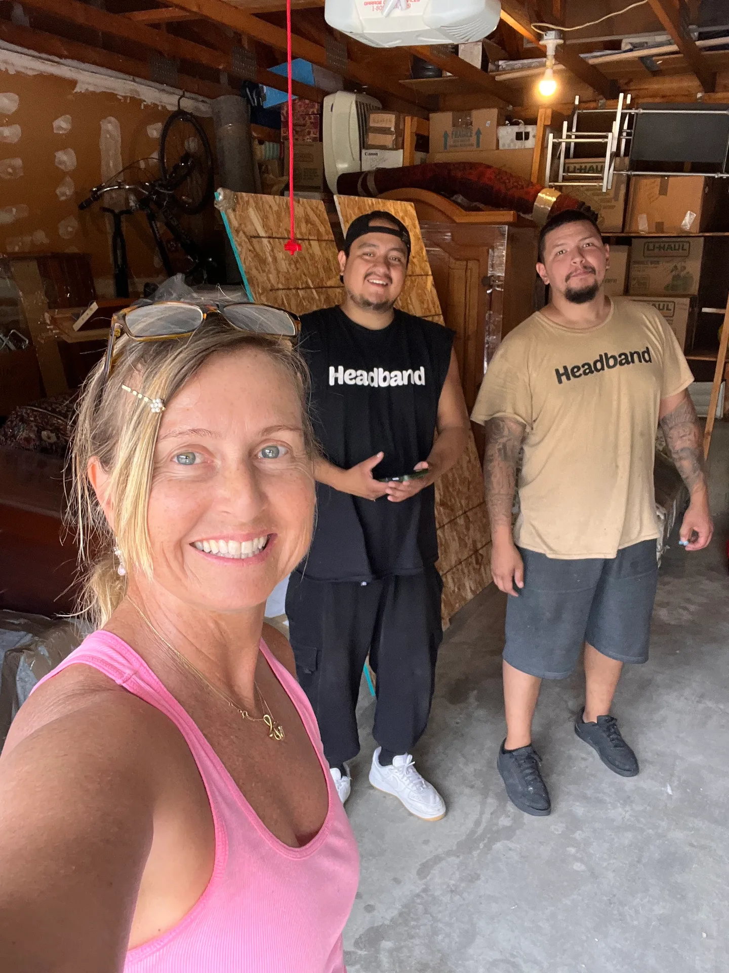 Headband Movers safely wrapping and guiding a large piece of furniture with guard rails during a move