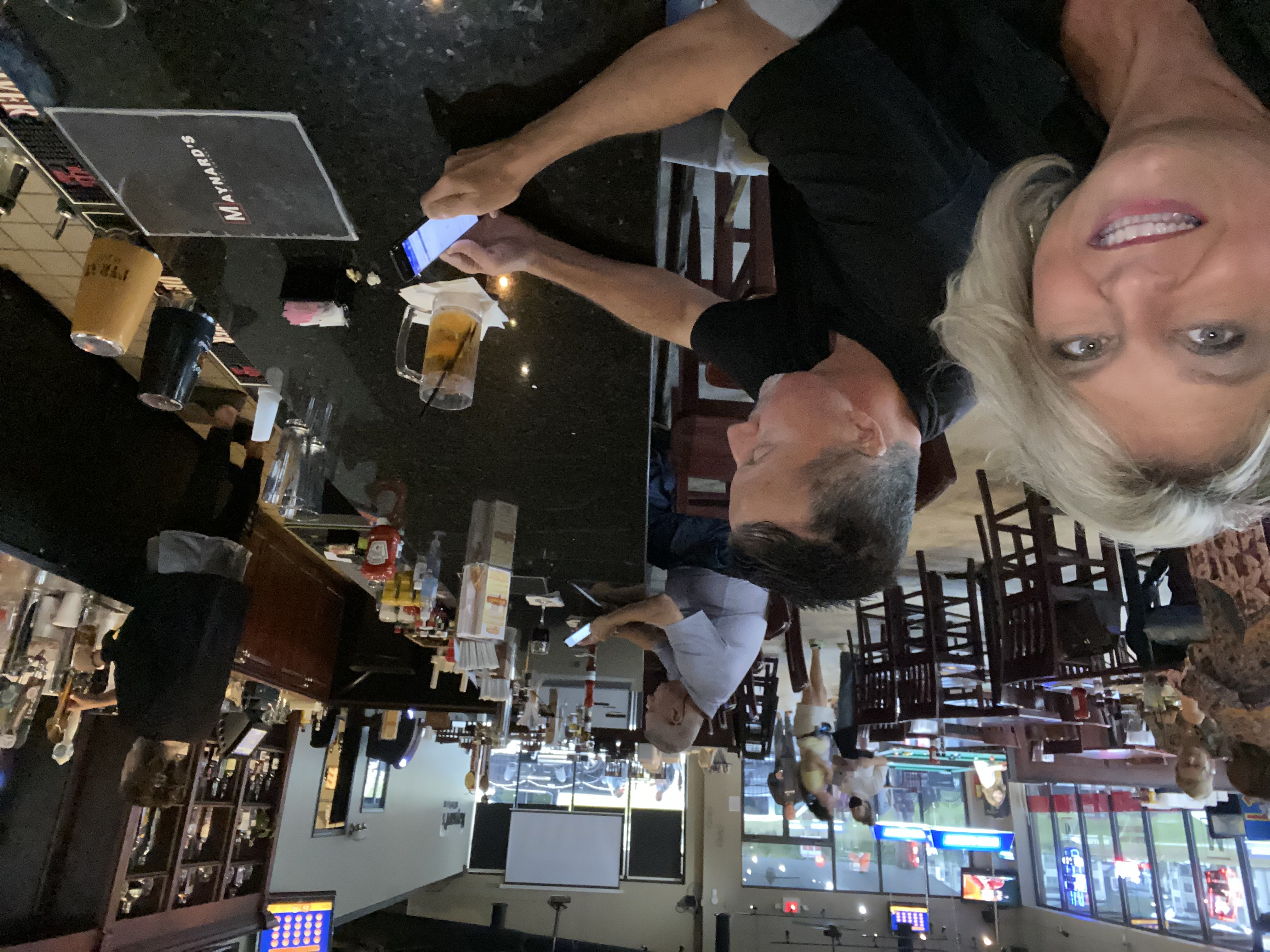 Casual bar and dining interior at Maynard's at the Corner BBQ restaurant in Flowery Branch Georgia