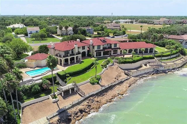 A Corpus Christi bayfront home on Ocean Drive, the kind of coastal address where windstorm and flood insurance shape the budget