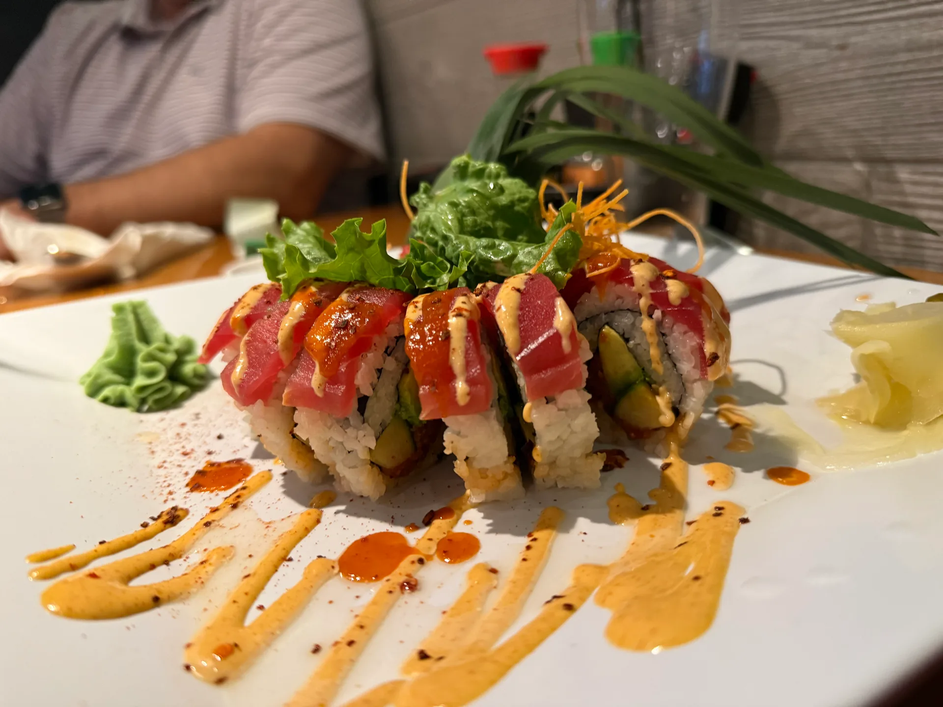 A sushi roll finished with spicy orange sauce and jalapeños at Nguyen's Asian Grill in Banner Elk
