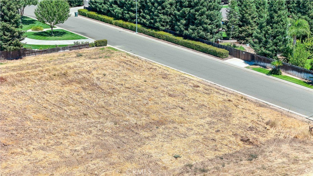 Aerial view of the 1-acre building lot at 1371 Shady Cove Ave in Atwater CA with adjacent homes