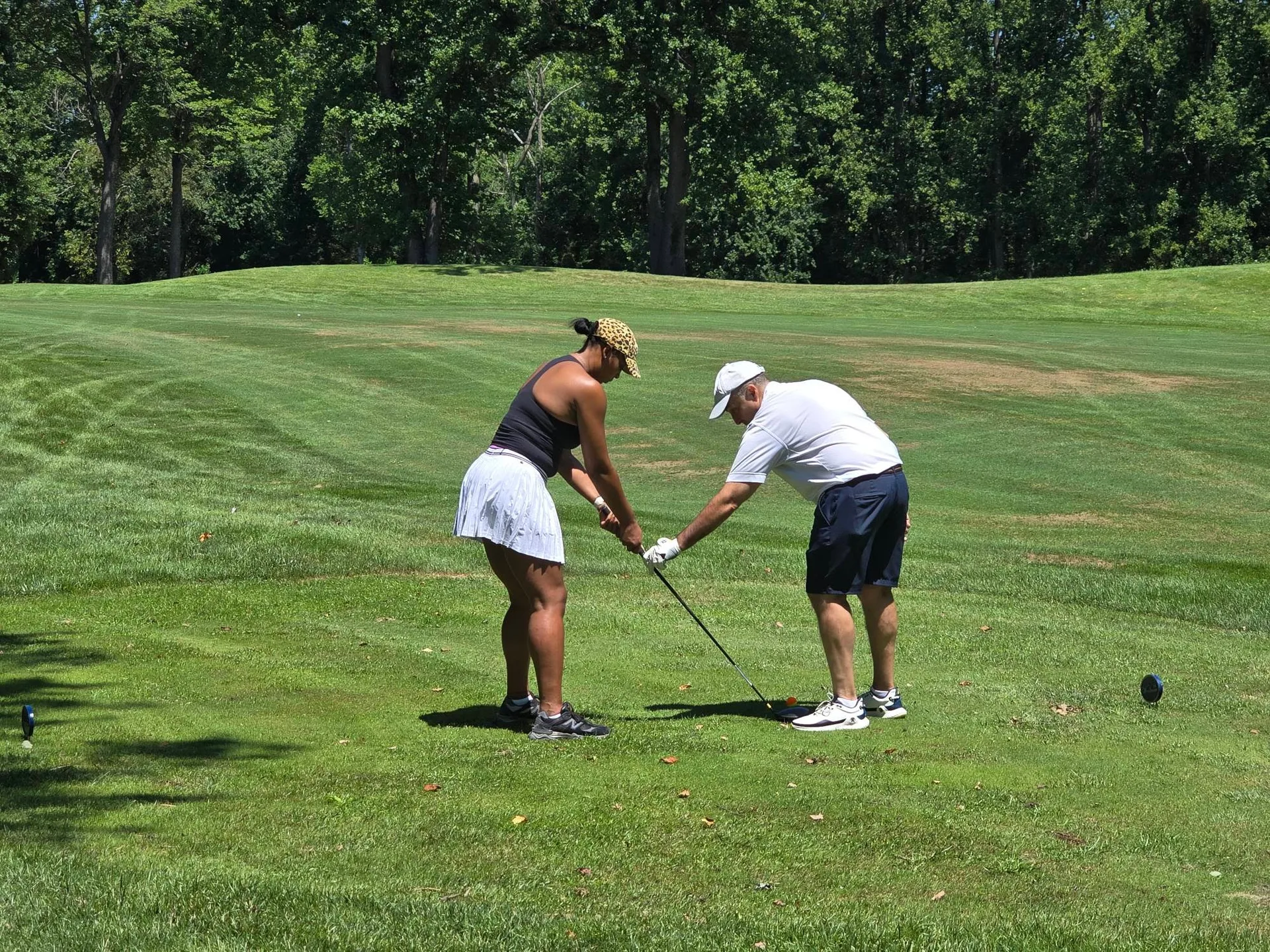 Golf lesson moment at the FORE the KIDS Golf Tournament