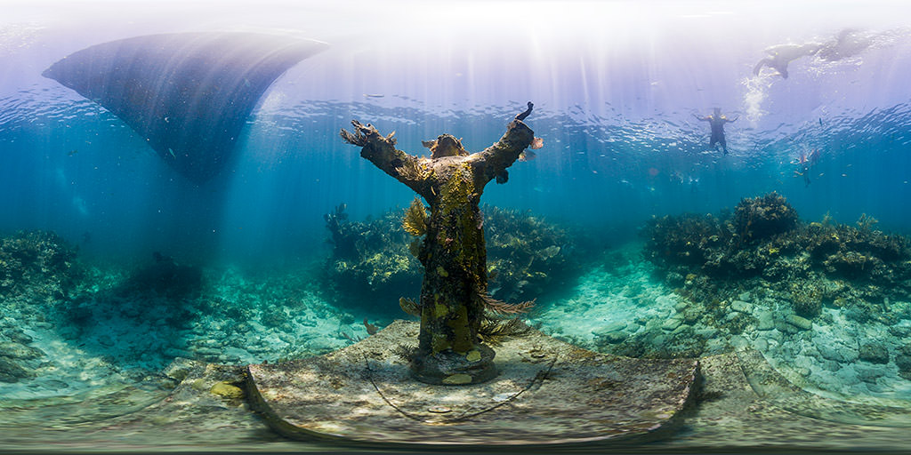 Underwater panoramic view of the famous Christ of the Abyss bronze statue at Key Largo Dry Rocks reef