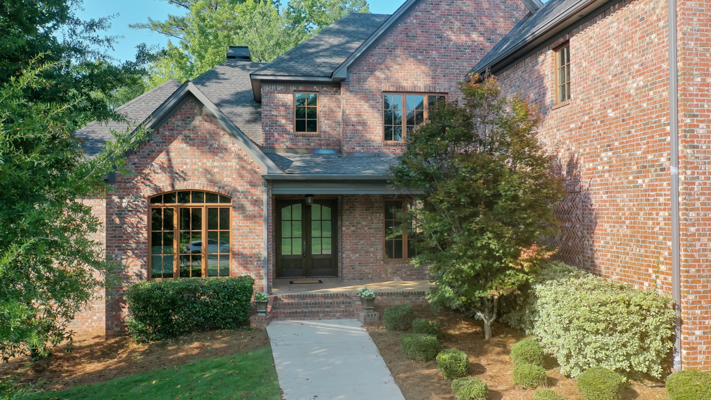 Front exterior view of 1412 Falls Crest Dr with landscaping