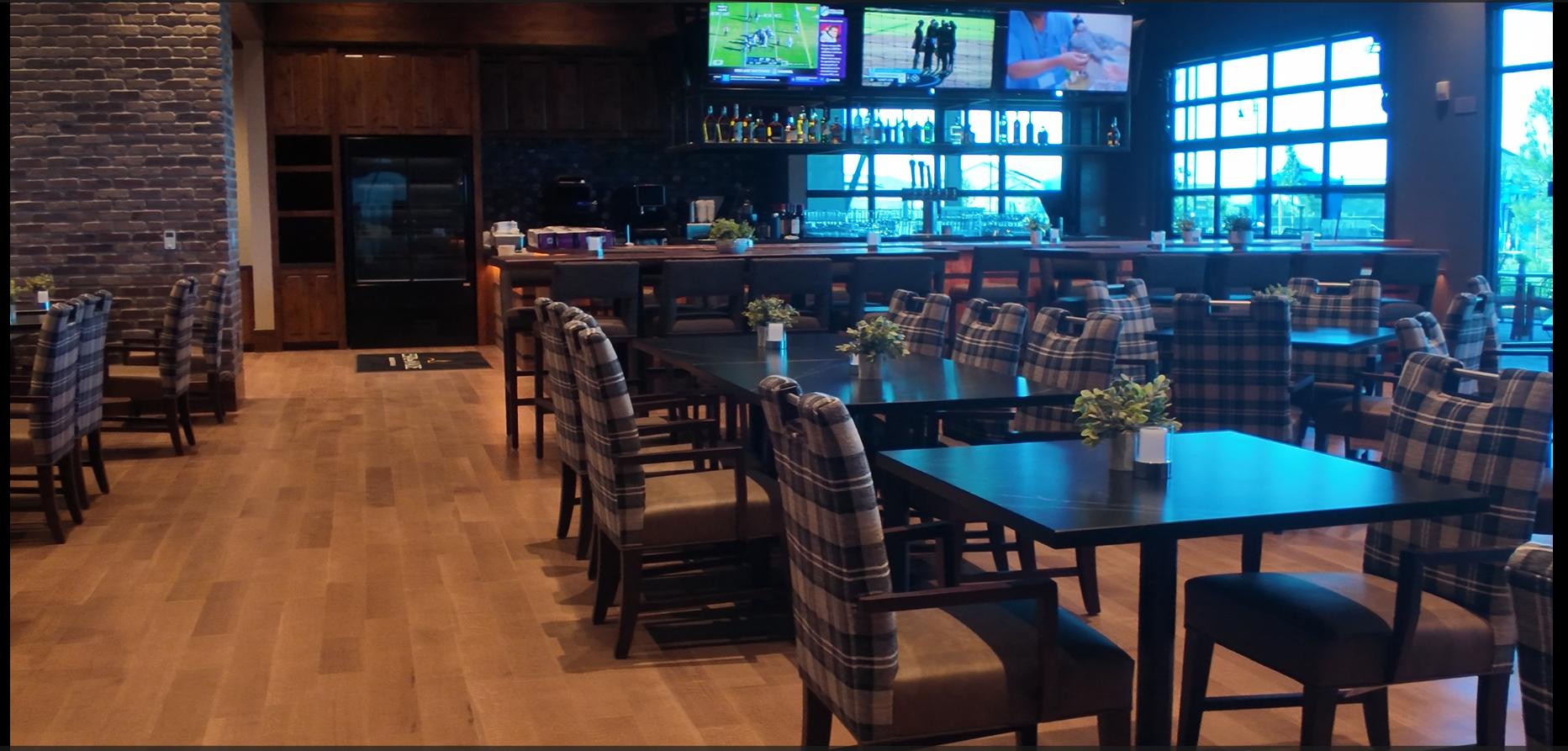 The interior of the Barrel House Bistro and Taproom at Esplanade at Madeira Ranch in Elk Grove, with a bar counter and seating