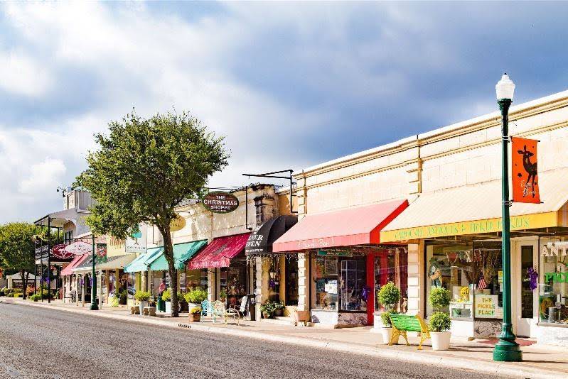 Boerne Main Street historic storefronts with pedestrian walkway in Texas Hill Country