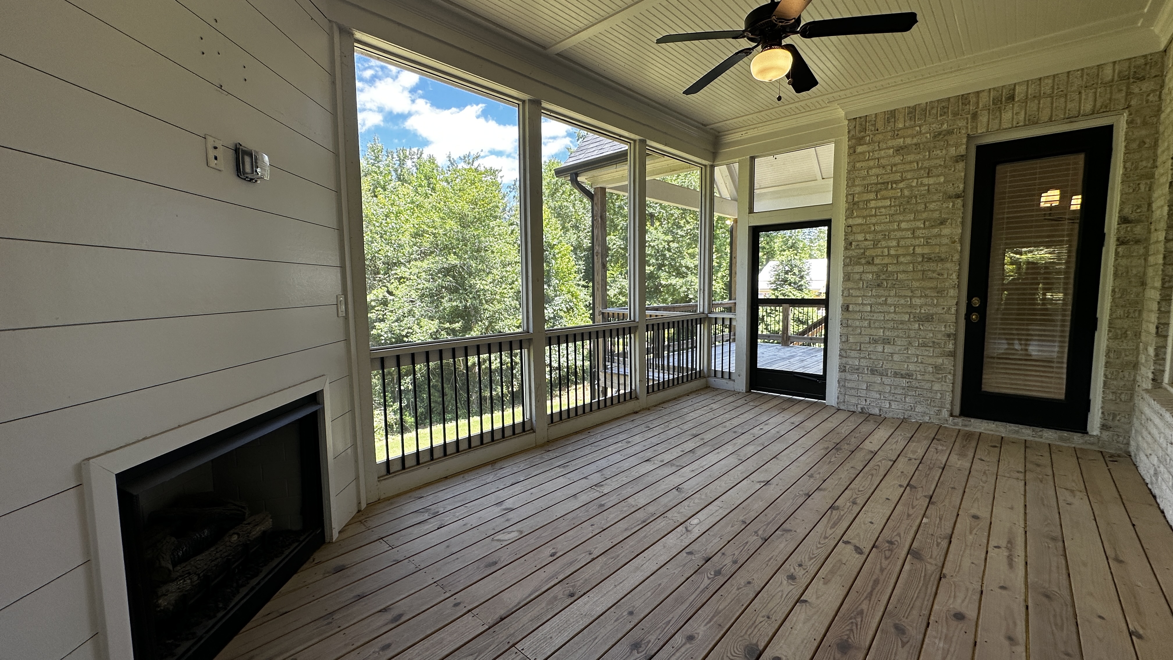 Great room at 5760 Lula Bridge Ct with farmhouse sink, vaulted ceiling, and wood beams
