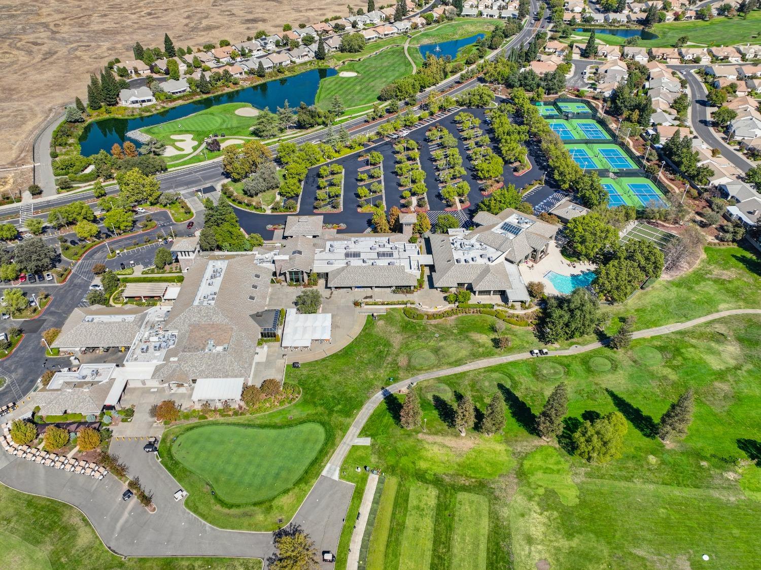 Aerial view of Sun City Roseville, the largest 55+ community in Roseville, California, with homes and fairways