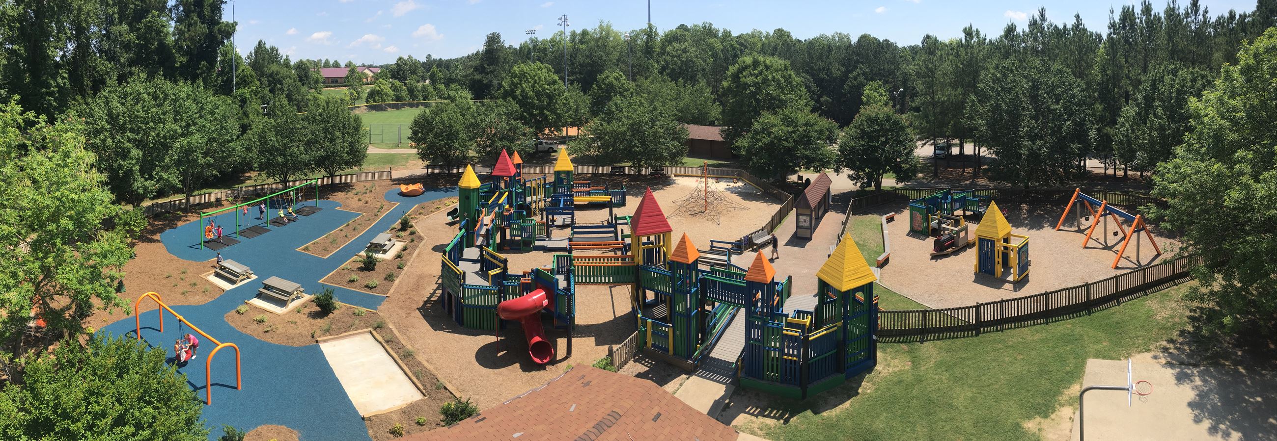 Kelly Road Park in Apex features athletic fields, playgrounds, and pedestrian bridge access to the Beaver Creek Greenway trail system
