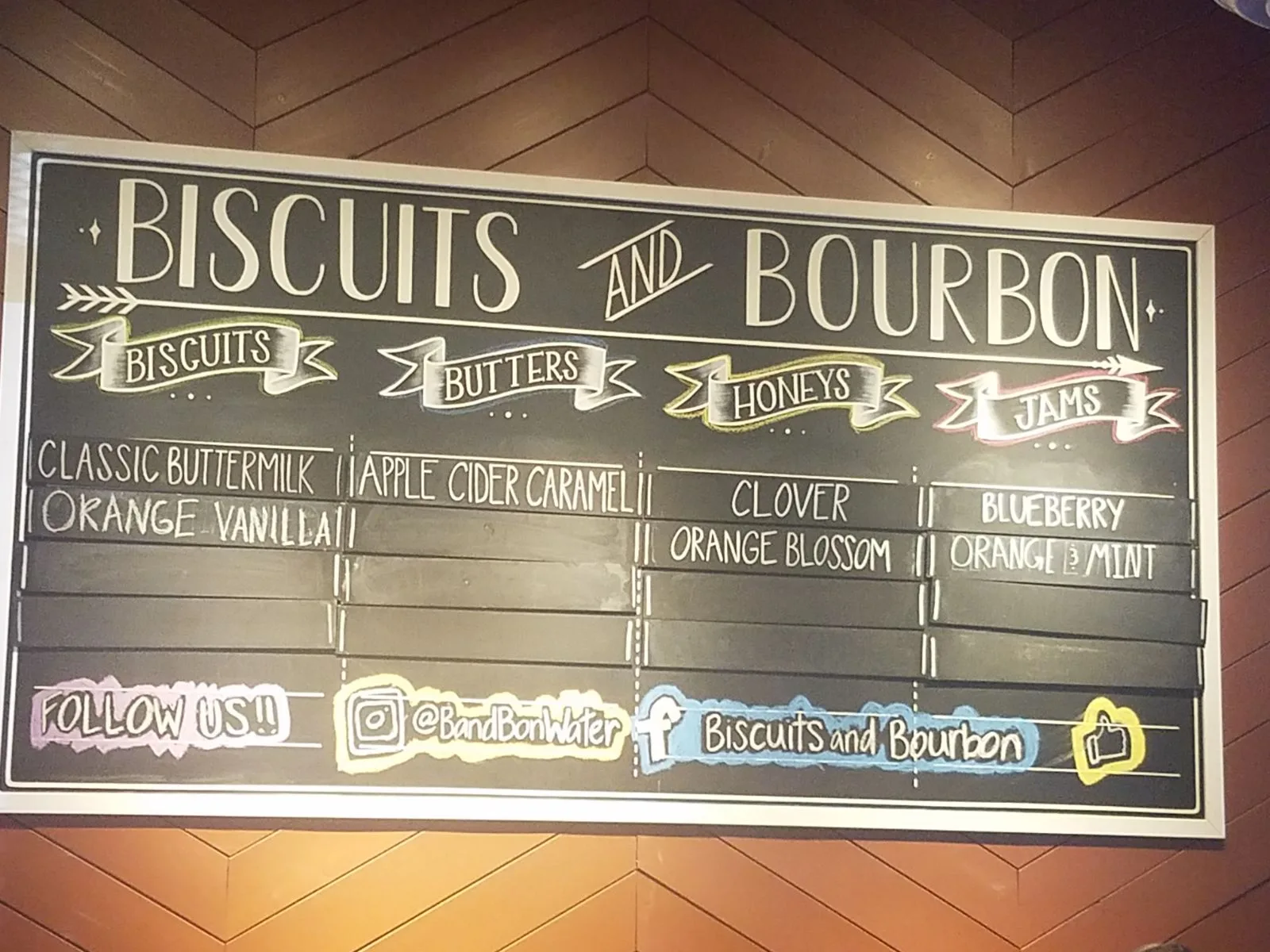 Biscuits and Bourbon menu board on Water Street in Henderson