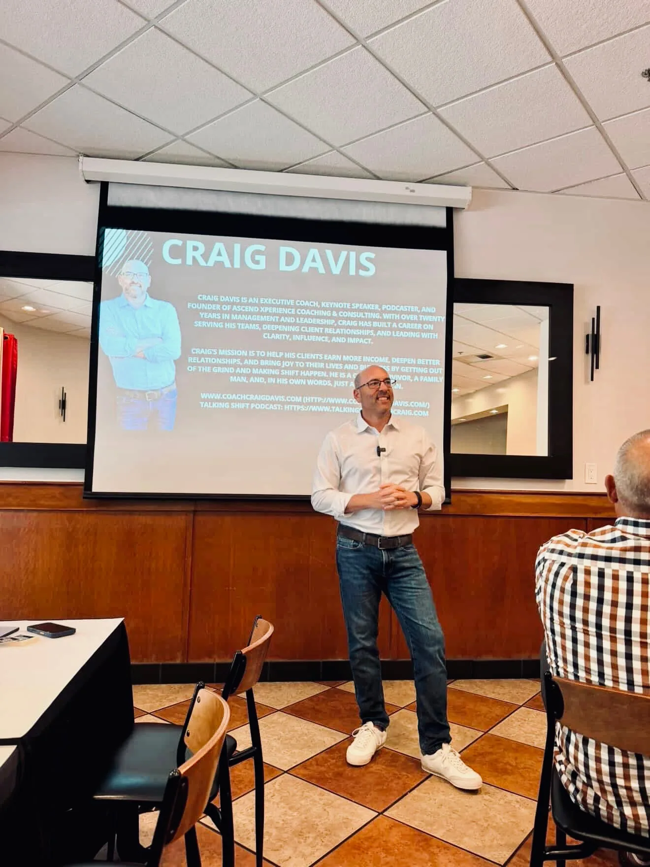 Craig Davis leading a workshop for The Mortgage Doctor with his intro slide on screen