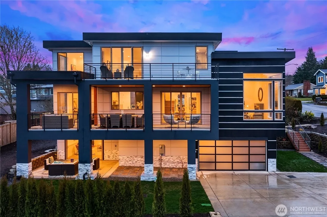 Modern luxury home at dusk with sunset sky in Kennydale, Renton