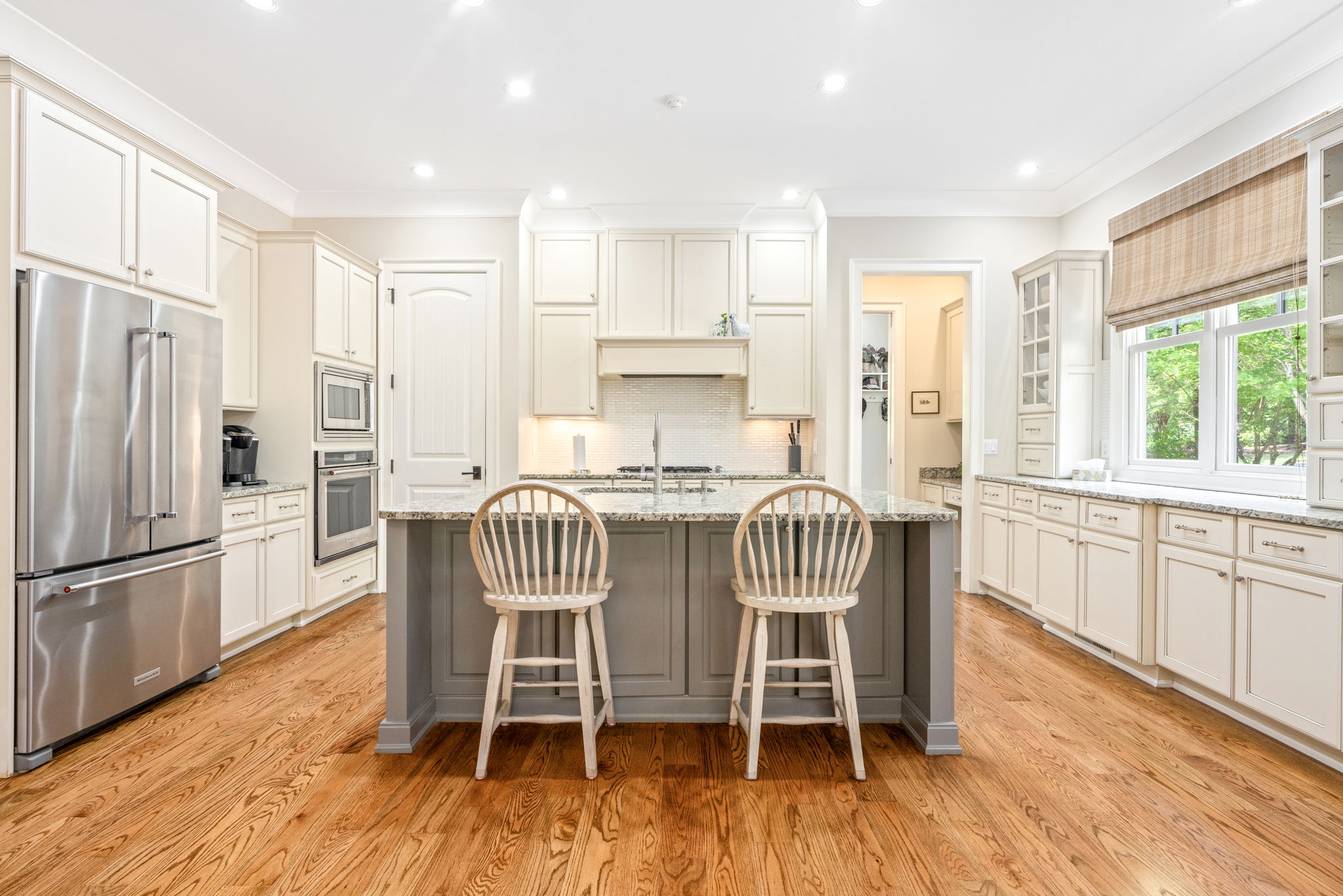 Kitchen with large island and pendant lighting