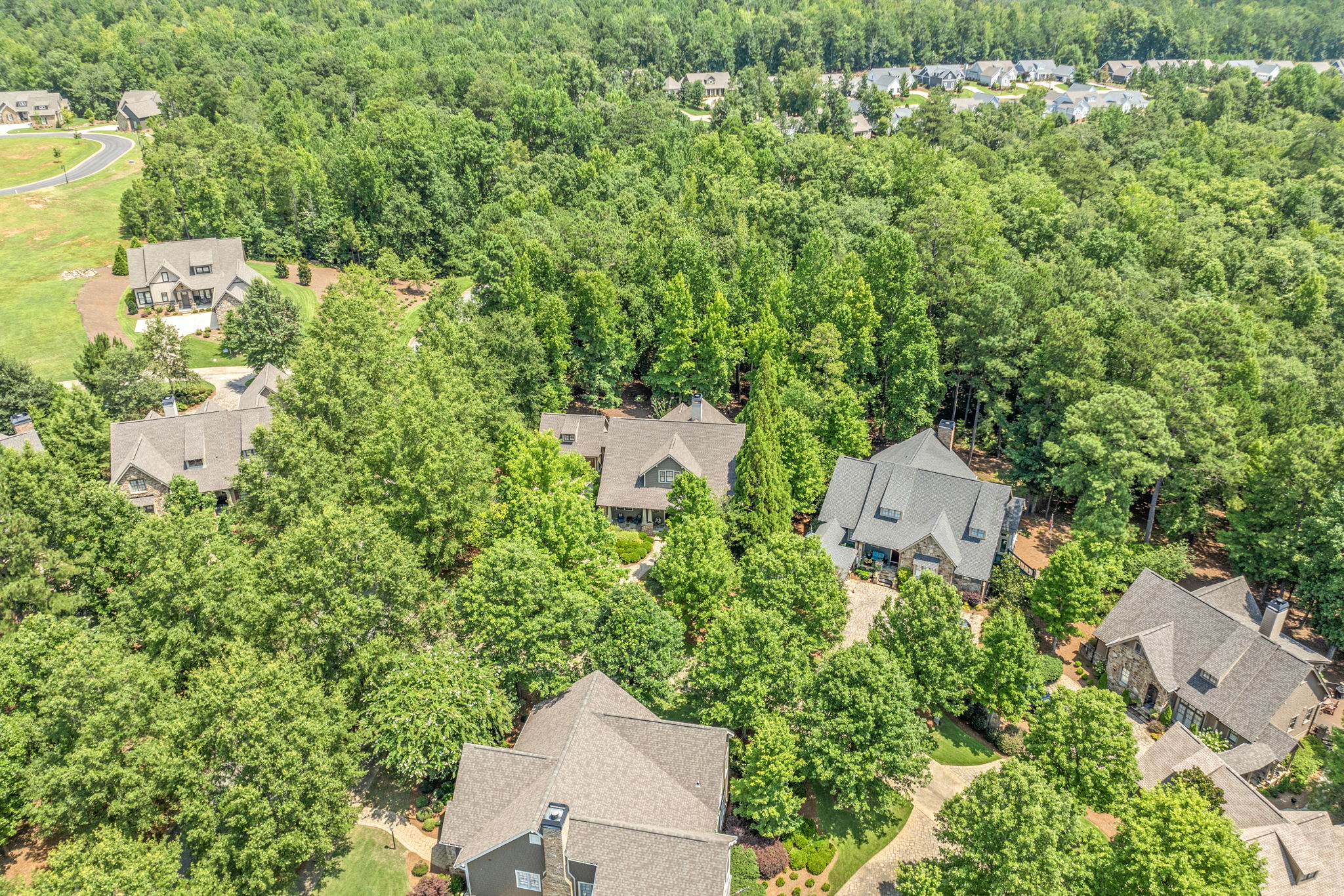 Aerial view of the home and surrounding landscape