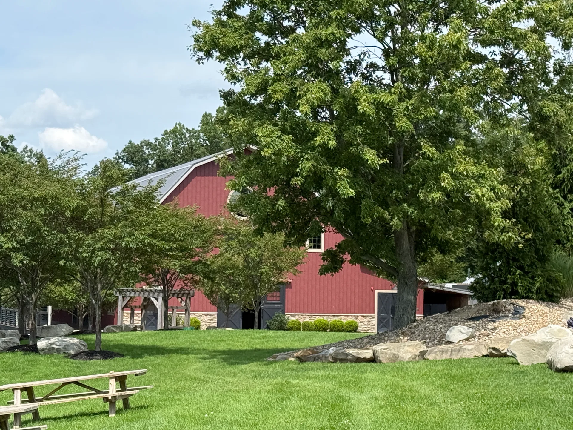 Barn front exterior with round window and stone foundation at Mapleside Farms in Brunswick, Ohio