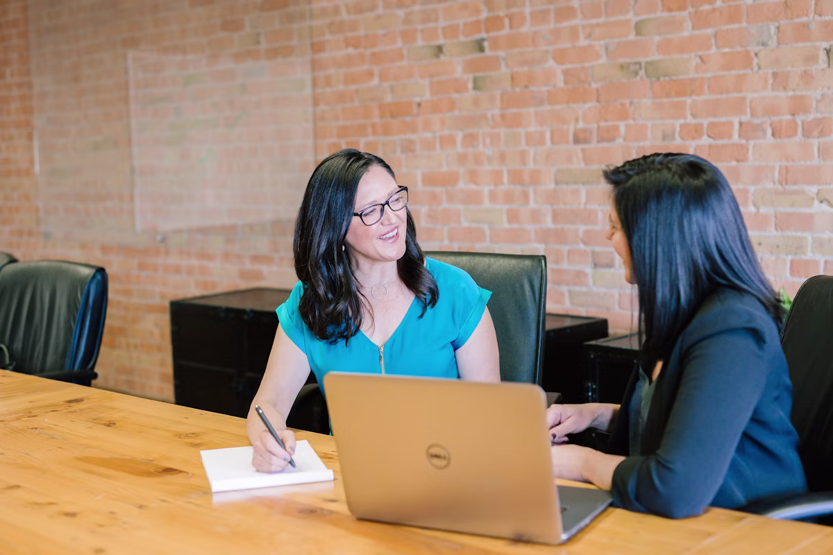 Personal home valuation consultation at a conference table