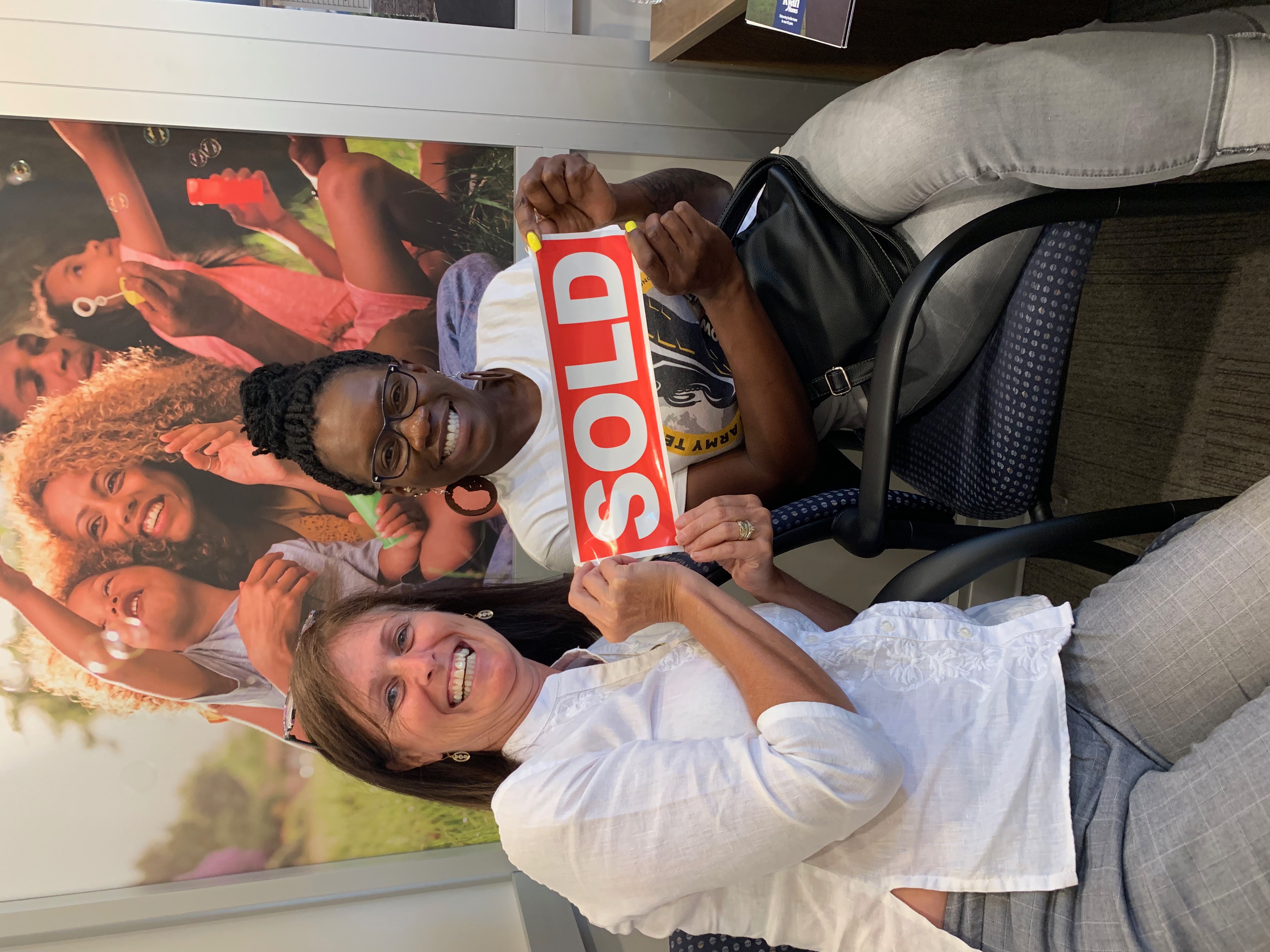 Client celebration photo — successful real estate transaction
