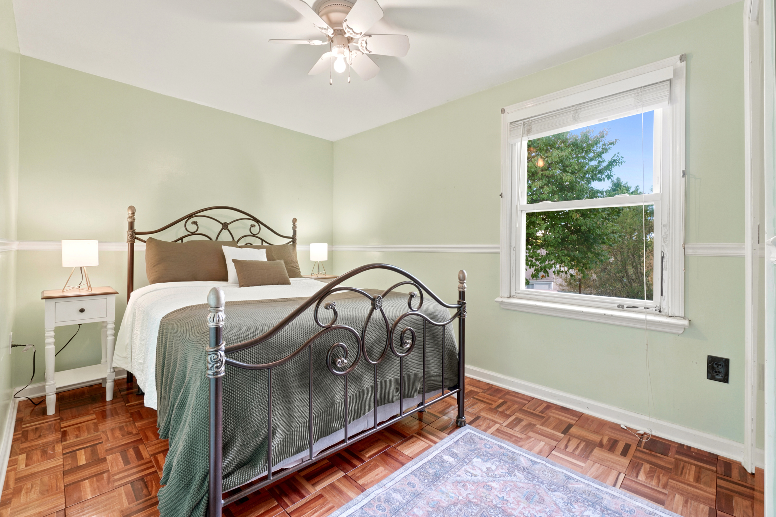 Upstairs bedroom at 50 Heather Ln with a window and light flooring