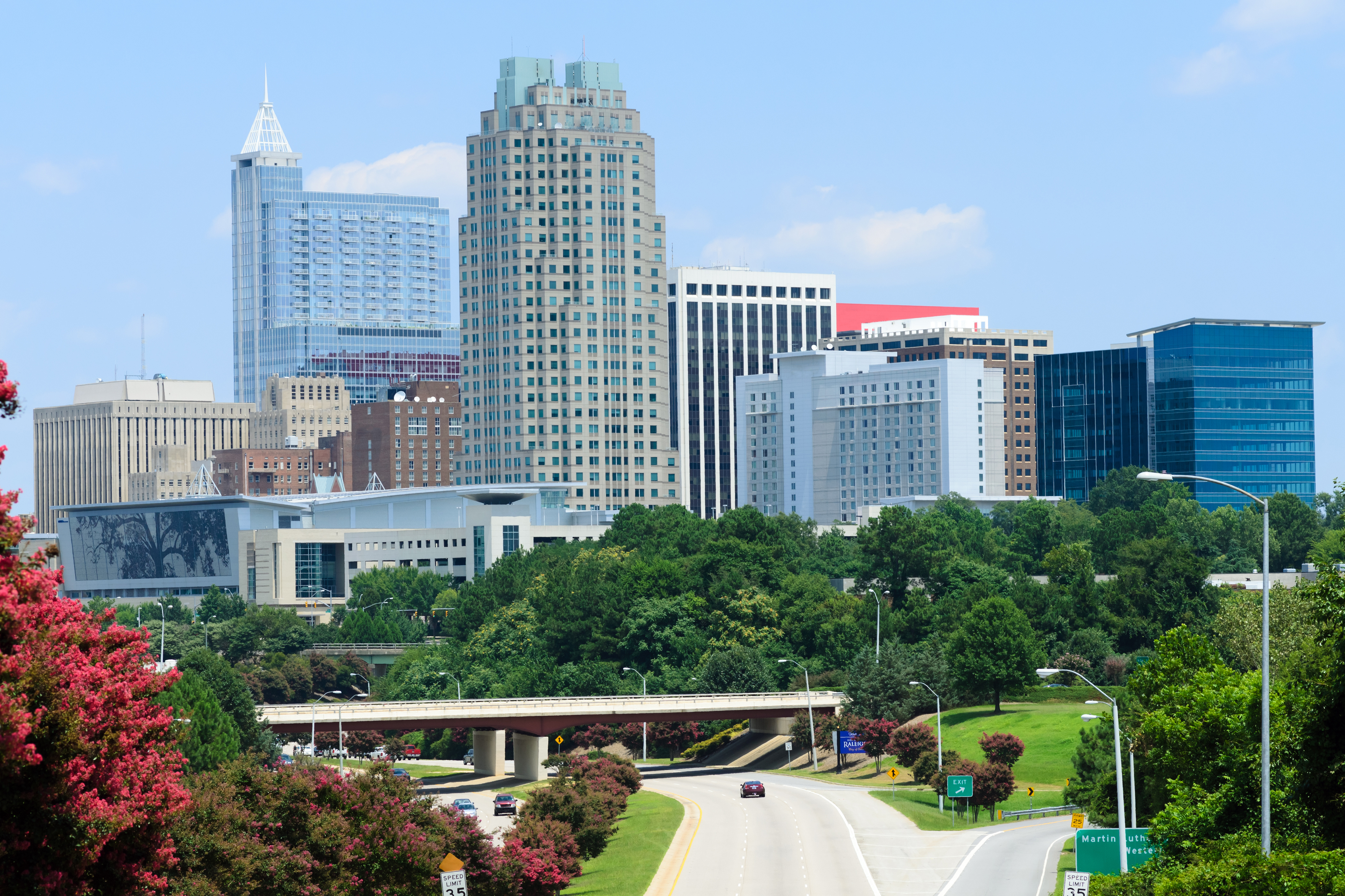 Daytime aerial view of downtown Raleigh, NC skyline and surrounding neighborhoods