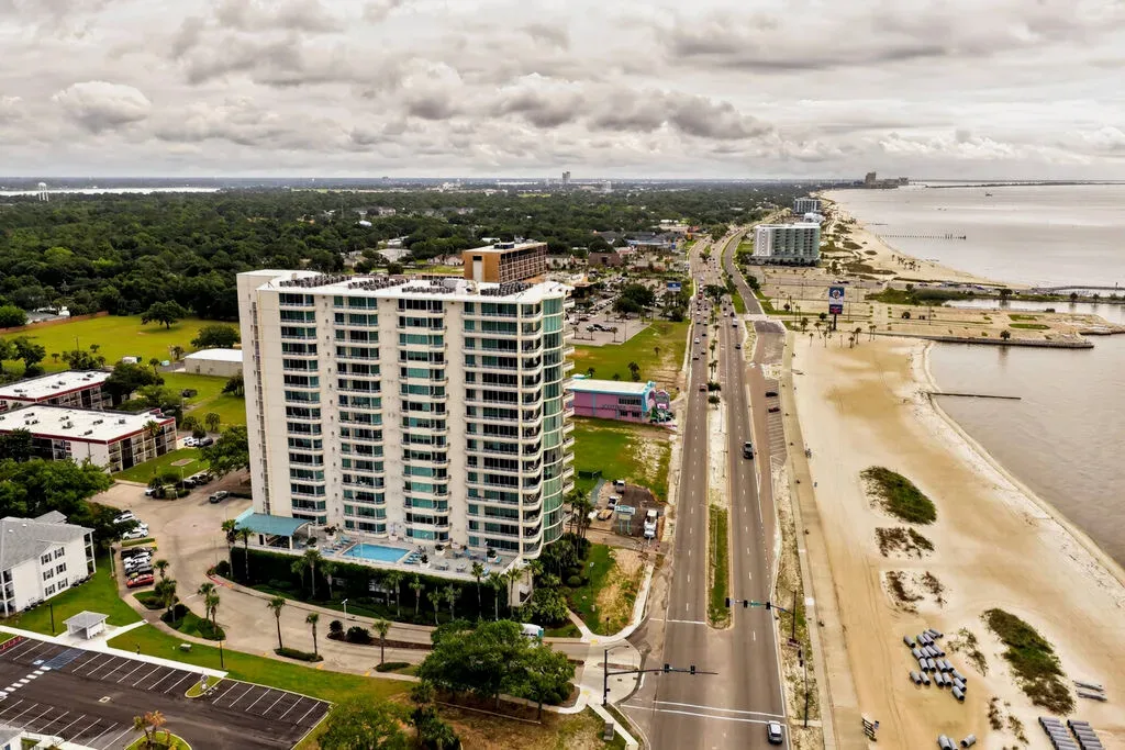 Aerial view of the Ocean Club high-rise condominium and surrounding beachfront community along the Mississippi Gulf Coast
