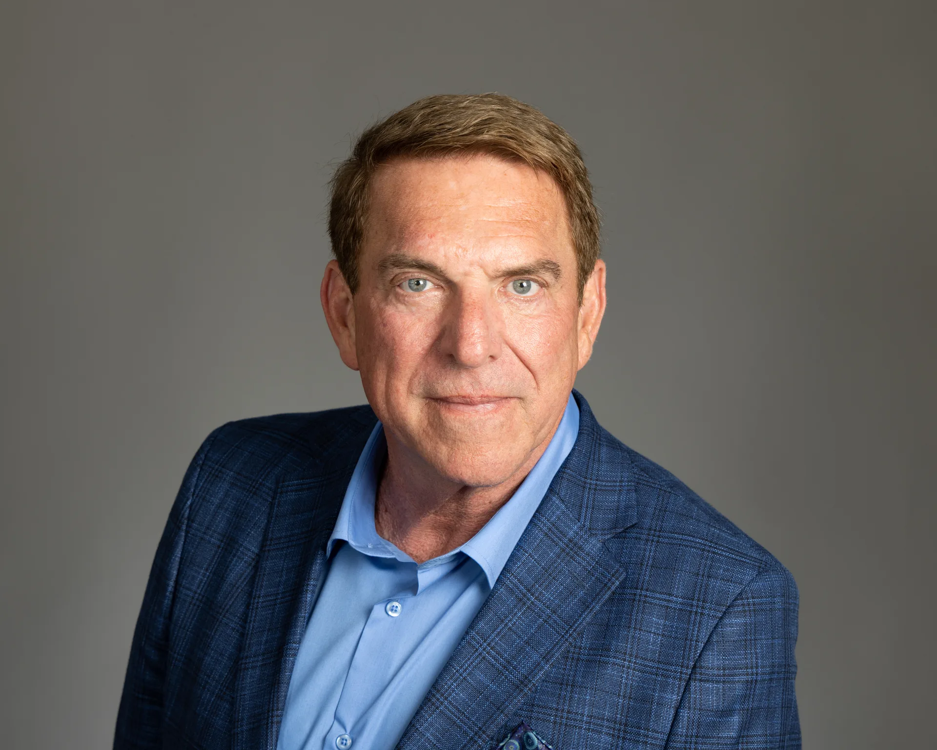 Headshot of Tim Fiebig wearing a blue plaid blazer, Castro Valley real estate agent