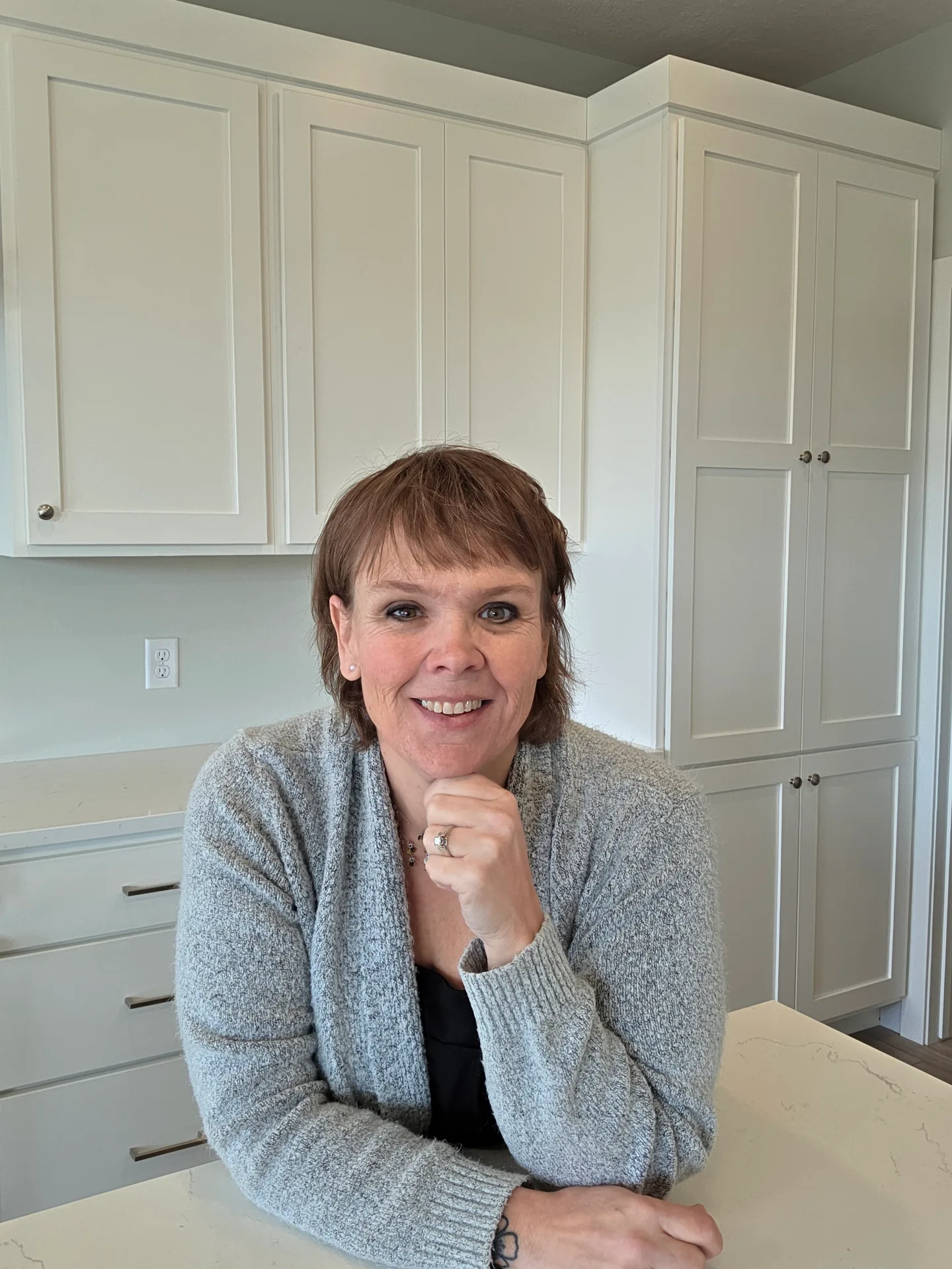 Jennifer Krosch evaluating a home interior with a builder's eye for condition and maintenance