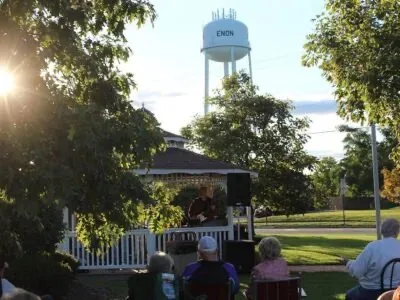 Community gathering at the Enon, Ohio gazebo with the village water tower
