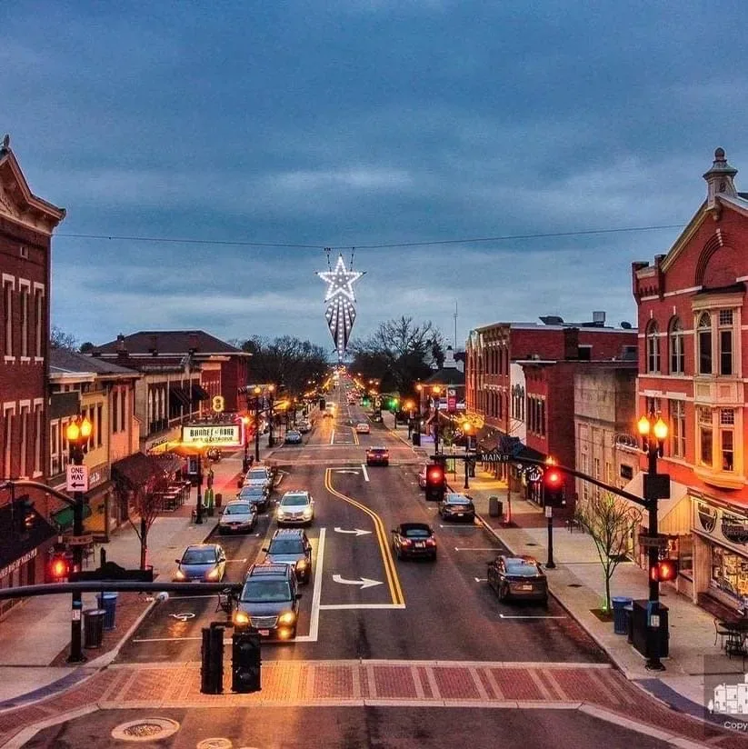 A classic Ohio main street at twilight with historic brick buildings