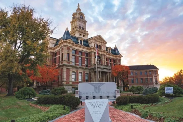 The Union County Courthouse and Veterans Plaza in Marysville, Ohio at sunset